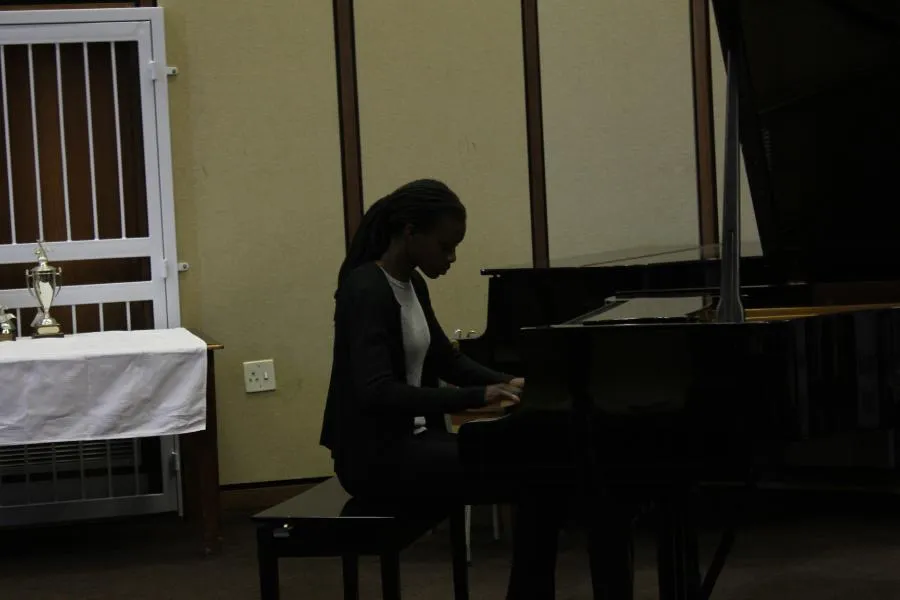 Student at grand piano